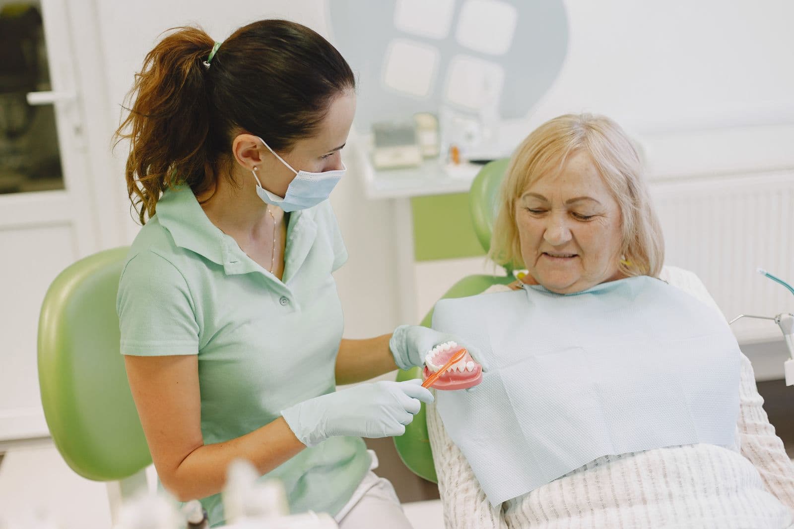 What is the effect of gum recession on dentures?